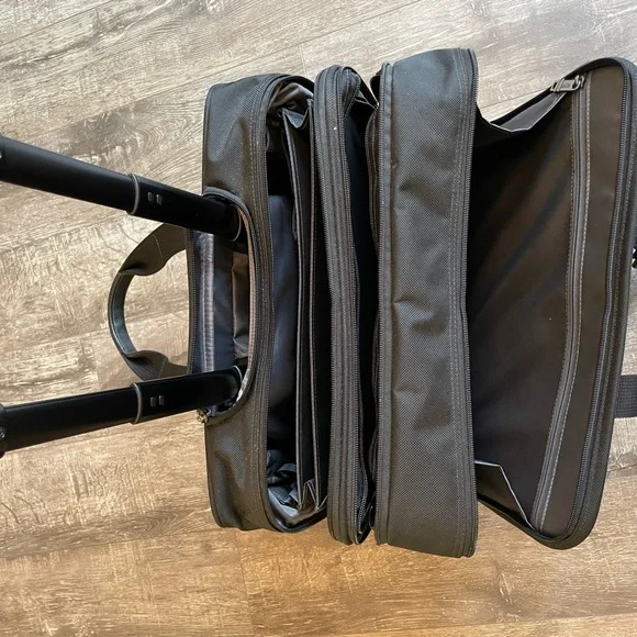 Black Tumi wheeled briefcase/carryon